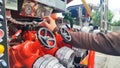 Close up of male hand on control valve in fire engine Royalty Free Stock Photo
