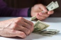 Close up male hand Counting money us dollar. Financial business concept Royalty Free Stock Photo