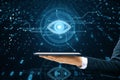 Close up of male hand holding cellphone with cyber spy technology hologram, virtual eye of internet control surveillance and Royalty Free Stock Photo