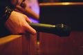 Close up male hand holding microphone. in the interior of the bar. Royalty Free Stock Photo
