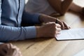 Close up male hand holding pen and signing legal document Royalty Free Stock Photo