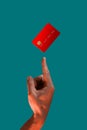 Close up male hand and levitating template mockup bank credit card with online service on green background