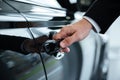 Close up of a male hand opening a car door Royalty Free Stock Photo