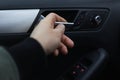 Close-up of male hand opening car door from inside. Royalty Free Stock Photo