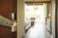 Close-up of male hand opening hotel room