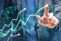 Close up of male hand pointing at growing upward chart, map, arrows and forex graph on blurry background. Global trends, trading Royalty Free Stock Photo