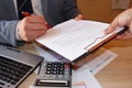 Close up of male hand putting signature in contract, businessman signing document. Successful negotiation concept, agreeing to ter Royalty Free Stock Photo