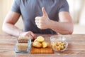 Close up of male hands with carbohydrate food