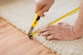 Close up of male hands cutting carpet