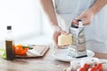 Close up of male hands grating cheese Royalty Free Stock Photo