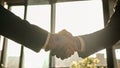 Close up male hands handshaking in sunny office. Multiethnic Caucasian and African business people diverse men Royalty Free Stock Photo
