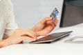 Close up male hands holding credit card and using pc computer Royalty Free Stock Photo