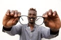 Close up of male hands holding a pair of glasses