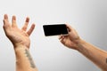 Close up male hands holding phone with blank screen during online watching of popular sport matches and championships Royalty Free Stock Photo