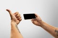 Close up male hands holding phone with blank screen during online watching of popular sport matches and championships Royalty Free Stock Photo