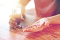 Close up of male hands holding pills and water Royalty Free Stock Photo