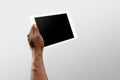 Close up male hands holding tablet with blank screen during online watching of popular sport matches and championships Royalty Free Stock Photo