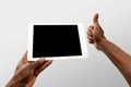 Close up male hands holding tablet with blank screen during online watching of popular sport matches and championships