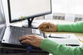 Close-up of male hands on mouse and over black keyboard of laptop during typing Royalty Free Stock Photo