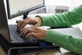 Close-up of male hands over black keyboard of laptop during typing Royalty Free Stock Photo