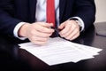 Close-up of male hands with pen over document Royalty Free Stock Photo