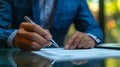 Close-up of male hands with pen over document Royalty Free Stock Photo