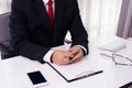 Close-up of male hands with pen over document Royalty Free Stock Photo