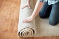 Close up of male hands rolling carpet Royalty Free Stock Photo