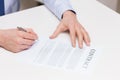 Close up of male hands signing contract document Royalty Free Stock Photo