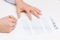 Close up of male hands signing contract document Royalty Free Stock Photo