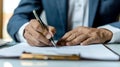 Professional businessman signing a contract, close-up of hands with pen. Legal documentation concept with focused Royalty Free Stock Photo