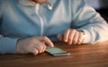 Close-up of male hands surfing internet on modern smartphone. Royalty Free Stock Photo