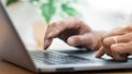 Close-up of male hands typing on keyboard Working On Compute Sitting Table And Office Tools At Workplace, writing emails, Royalty Free Stock Photo