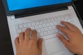 Close-up of male hands typing on laptop keyboard Royalty Free Stock Photo