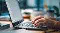 Close Up Of Male Hands Typing On Laptop Keyboard In Modern Office Setting Featuring Blurred Screen Background With Professional Royalty Free Stock Photo