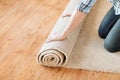 Close up of male hands unrolling carpet Royalty Free Stock Photo