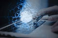 Close up of male hands using laptop keyboard with glowing blue linear sphere on blurry background. Geometric cyberspace, network