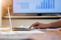 Close-up of male hands using laptop, man`s hands typing on laptop keyboard, side view of businessman using computer in meeting Royalty Free Stock Photo