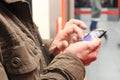 close up of male hands using a smartphone