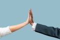 Close up of male hands with vitiligo pigments isolated on blue studio background Royalty Free Stock Photo