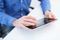 Close up of male hands working with tablet pc