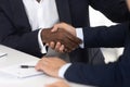 Close up of male handshake after effective negotiation