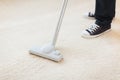 Close up of male hoovering carpet Royalty Free Stock Photo