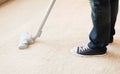 Close up of male hoovering carpet Royalty Free Stock Photo