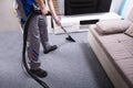 Janitor Cleaning Carpet With Vacuum Cleaner Royalty Free Stock Photo