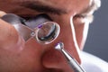 Jeweler Looking At Diamond Through Magnifying Loupe Royalty Free Stock Photo