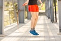 Close up of male legs skipping with jump rope outdoors. Exercising and lifestyle concept Royalty Free Stock Photo