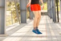 Close up of male legs skipping with jump rope outdoors. Exercising and lifestyle concept Royalty Free Stock Photo