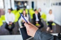 Close up of male mentor or coach hold paperwork, give flipchart presentation, talking with employees. Businessman have Royalty Free Stock Photo