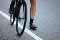 Close up of male muscular legs sitting on bike outdoors Royalty Free Stock Photo